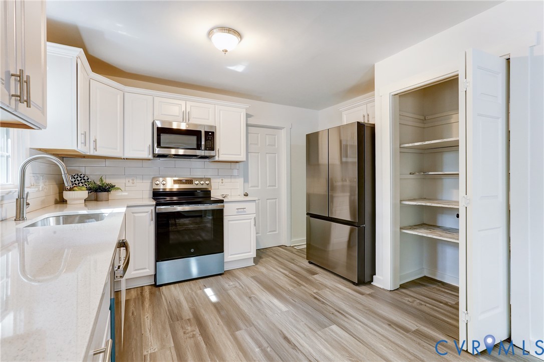 661 Greencastle Road Chesterfield, VA 23236 - Photo 10 of 28 a kitchen with a refrigerator stove and sink
