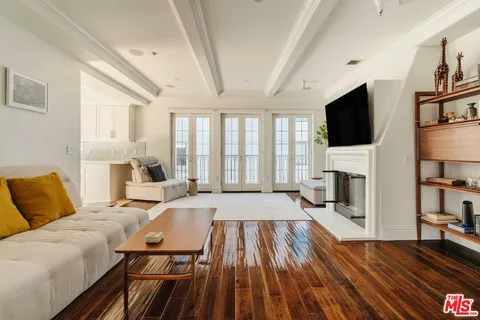 a living room with fireplace furniture and a flat screen tv