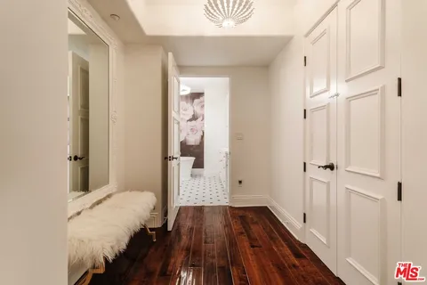 a view of bedroom with wooden floor