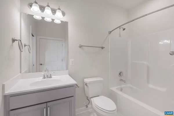 a bathroom with a sink a toilet and a bathtub