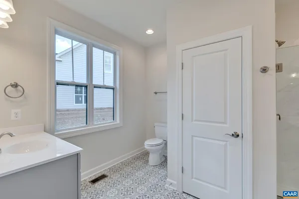 a bathroom with a sink toilet and vanity