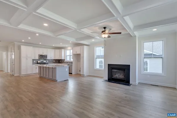 a view of kitchen with furniture and a fireplace