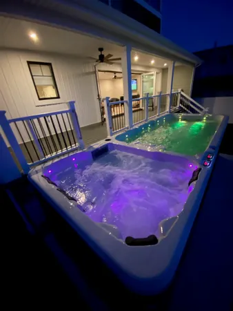 a room with pool table and paintings on the wall