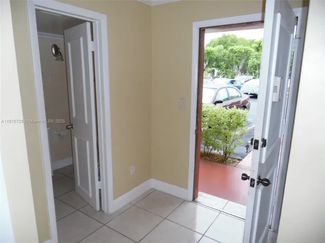 a view of a bathroom from a corridor
