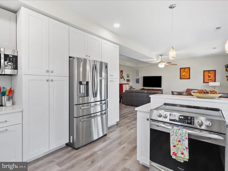 712 South Blue Ridge Avenue Culpeper, VA 22701 - Photo 13 of 47 a kitchen with stainless steel appliances a stove a refrigerator and a sink
