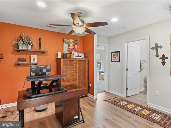 a bedroom with furniture and window