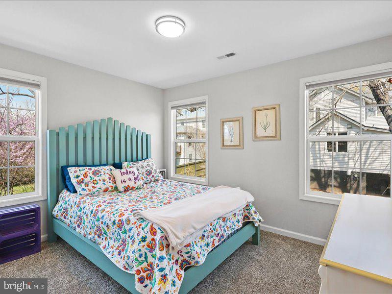 712 South Blue Ridge Avenue Culpeper, VA 22701 - Photo 24 of 47 a bedroom with a bed window and a couch