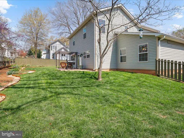 a house that has a tree in front of it