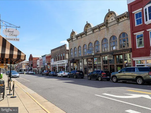 a city street lined with buildings and cars