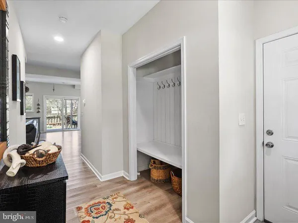 a bedroom with furniture and a rug