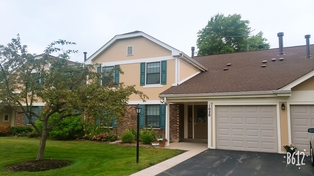 1020 Boxwood Court, Unit C2 Wheeling, IL 60090 - Photo 1 of 21 a front view of a house with a yard