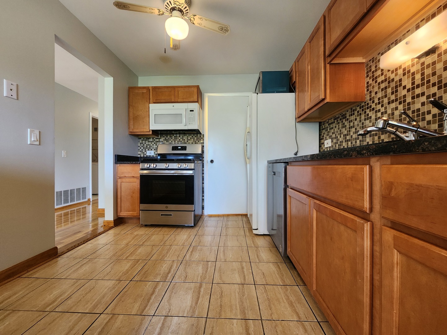 1020 Boxwood Court, Unit C2 Wheeling, IL 60090 - Photo 11 of 21 a kitchen with stainless steel appliances granite countertop a refrigerator a stove and a sink
