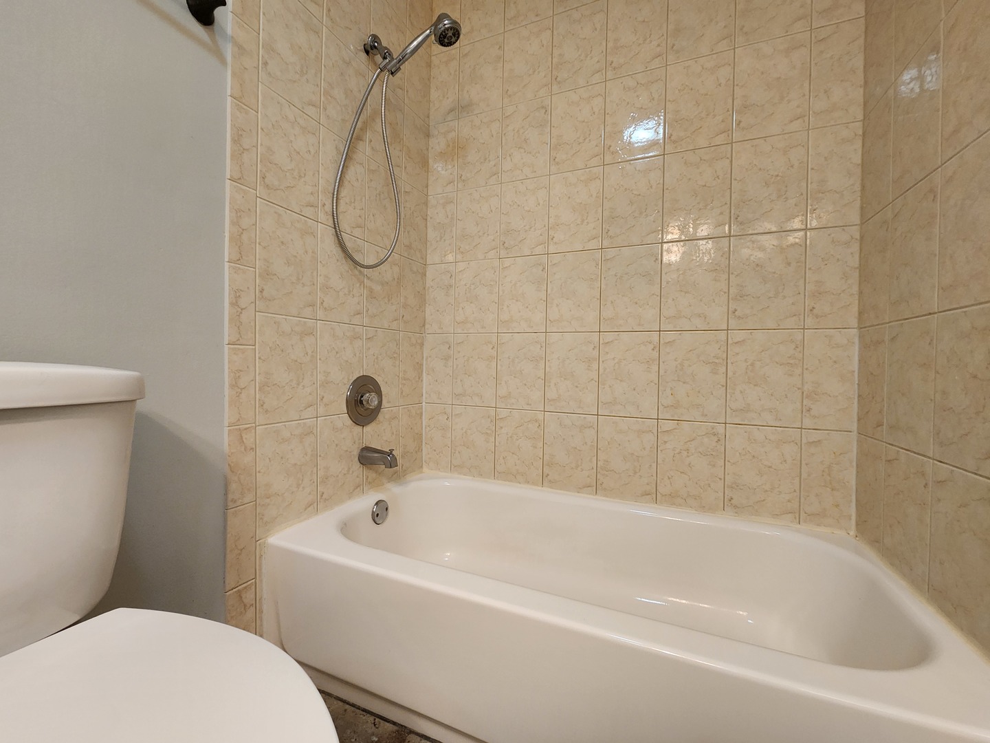 1020 Boxwood Court, Unit C2 Wheeling, IL 60090 - Photo 16 of 21 a white bath tub sitting next to a white toilet and a shower