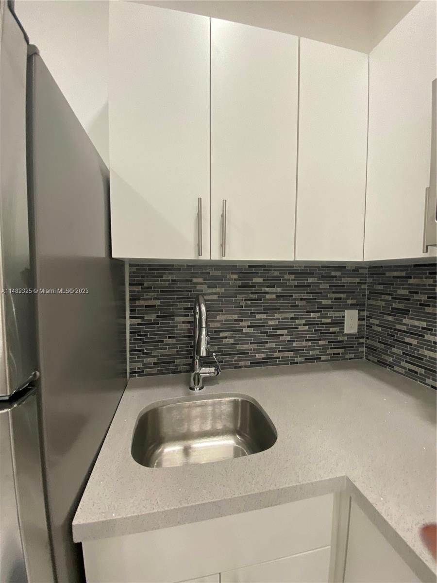 12829 Southwest 228th Street, Unit 2 Miami, FL 33170 - Photo 15 of 23 a close view of sink and tap