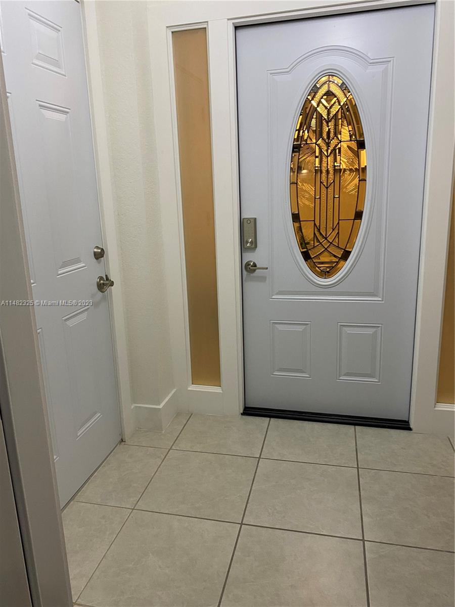 12829 Southwest 228th Street, Unit 2 Miami, FL 33170 - Photo 17 of 23 a view of a hallway with washer and dryer