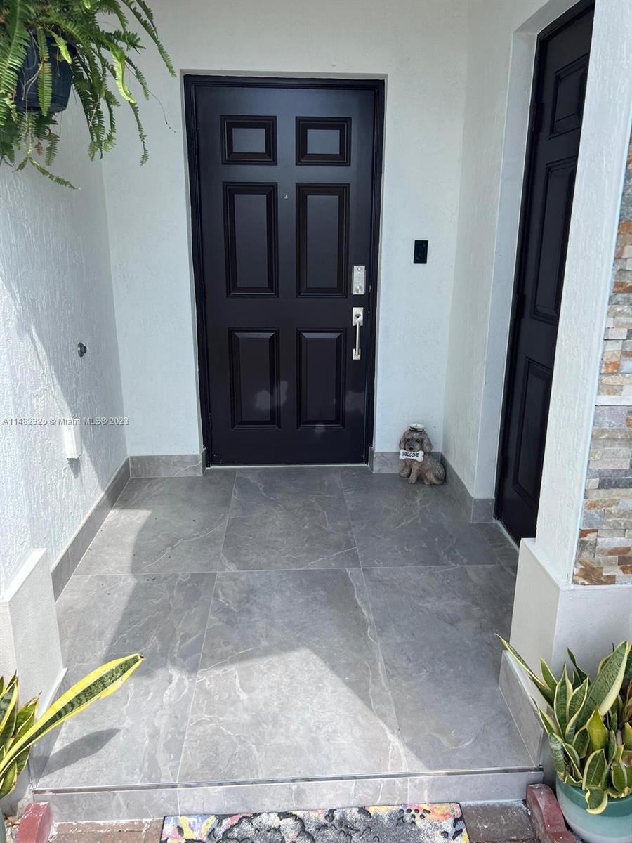 12829 Southwest 228th Street, Unit 2 Miami, FL 33170 - Photo 3 of 23 a view of front door