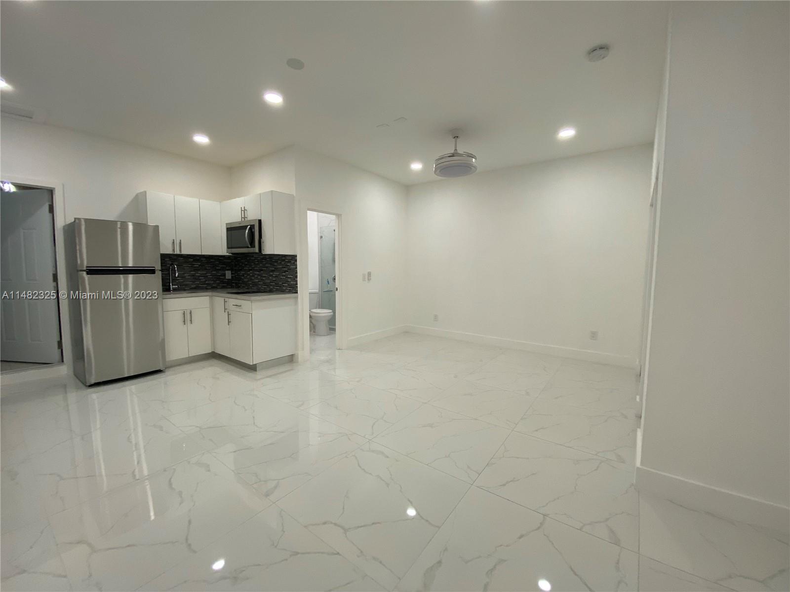 12829 Southwest 228th Street, Unit 2 Miami, FL 33170 - Photo 4 of 23 a view of a kitchen with a sink
