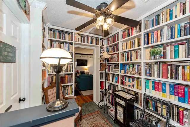 a view of a workspace with bookshelf