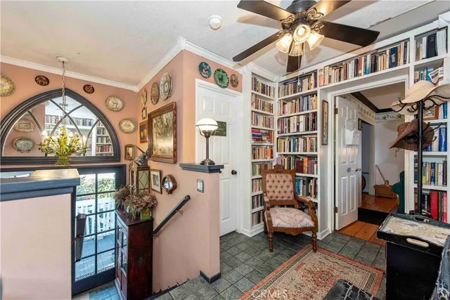 a view of front door and porch with wooden floor