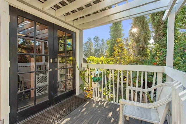 a view of a balcony with wooden floor