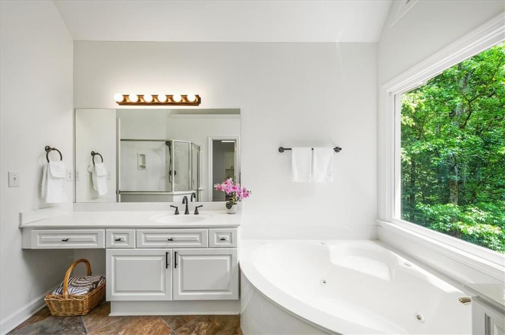 1710 Rising Mist Lane Cumming, GA 30041 - Photo 44 of 111 a bathroom with a sink and a mirror