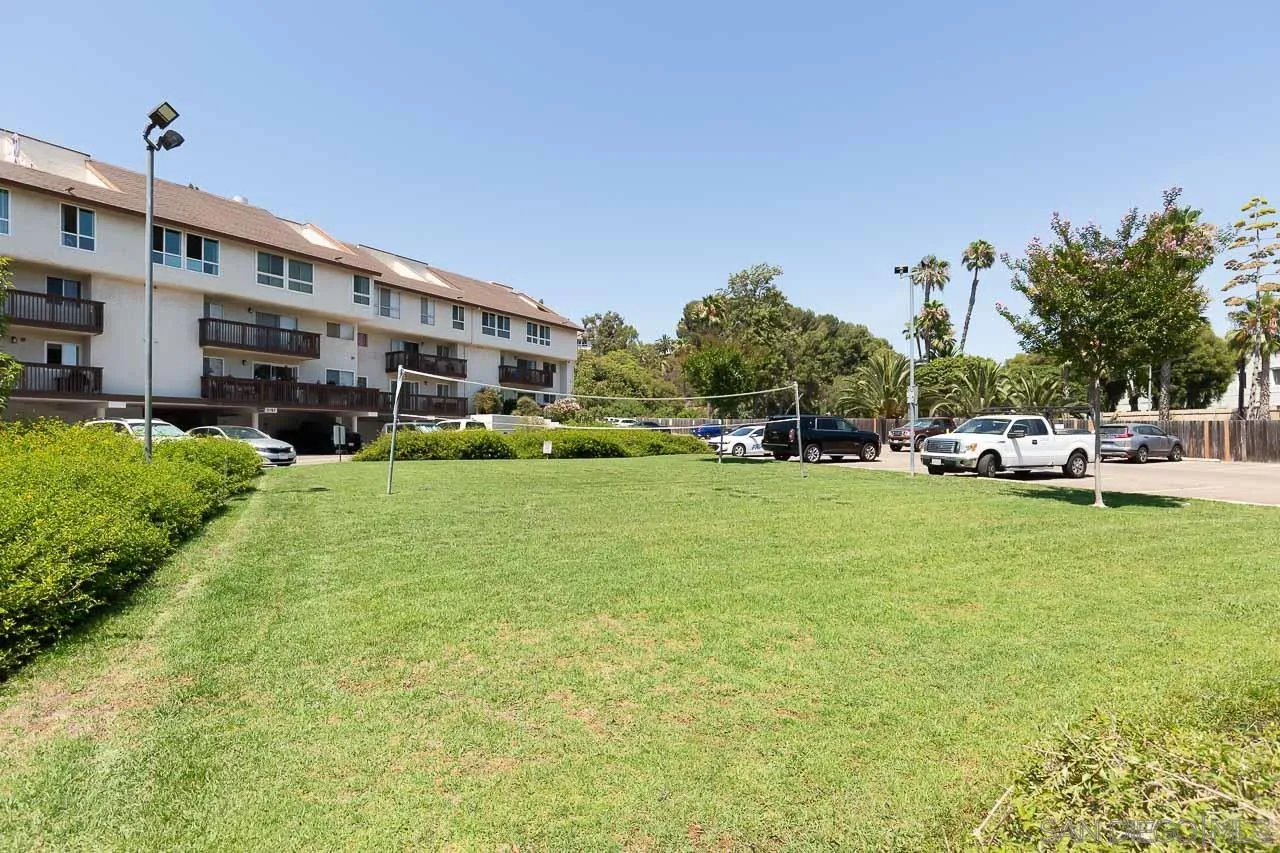6171 Rancho Mission Road, Unit 208 San Diego, CA 92108 - Photo 15 of 18 a front view of building with yard