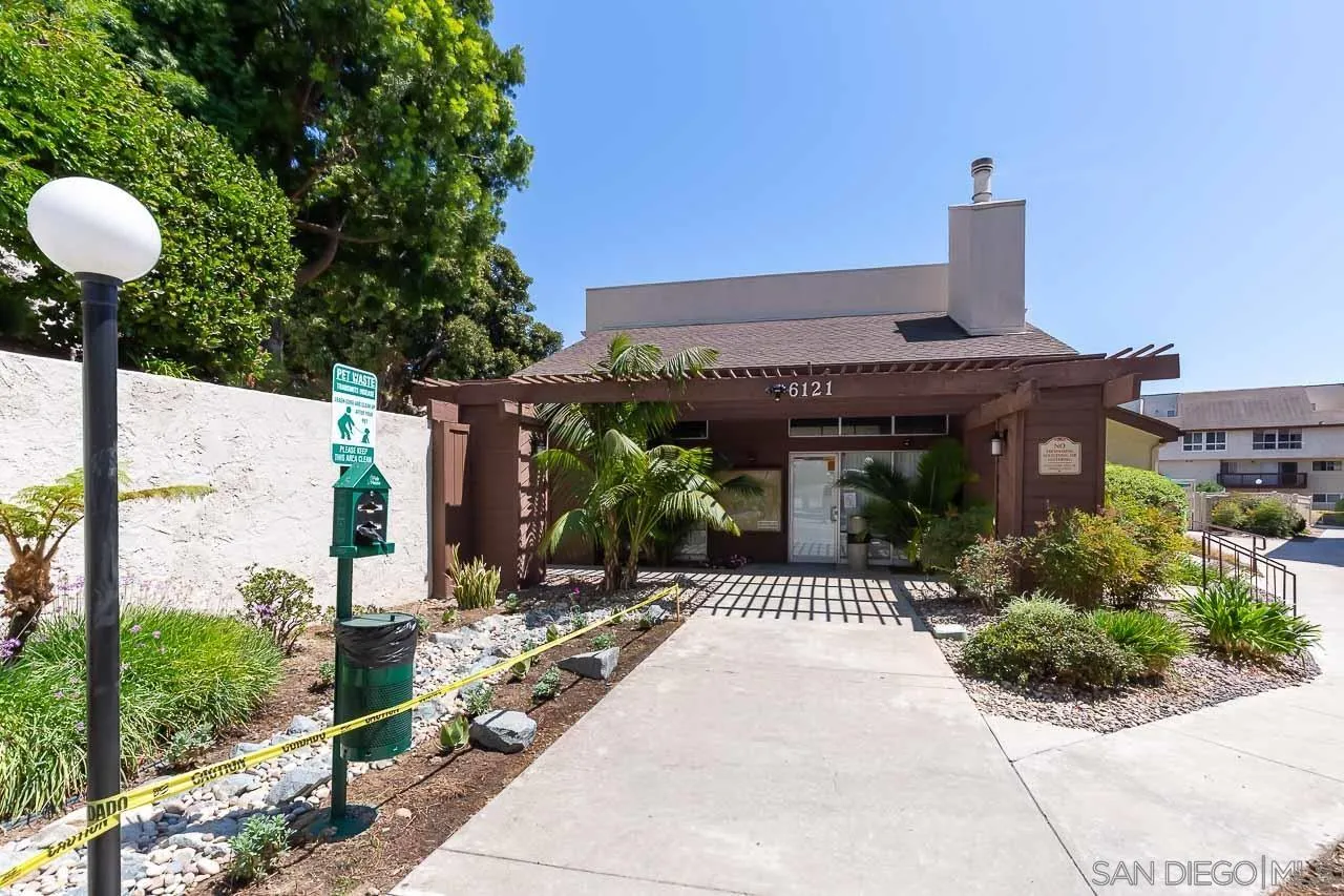 6171 Rancho Mission Road, Unit 208 San Diego, CA 92108 - Photo 16 of 18 a front view of a house with garden
