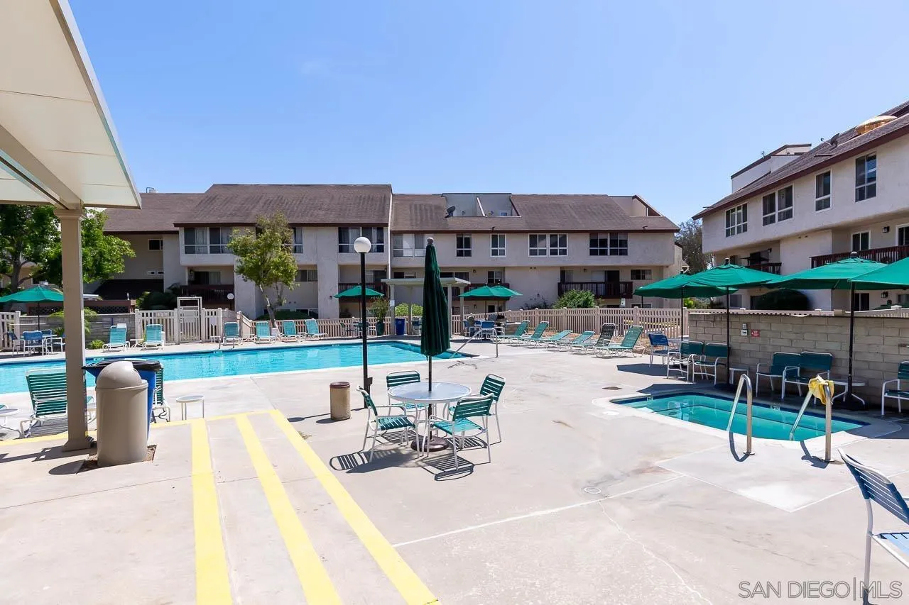6171 Rancho Mission Road, Unit 208 San Diego, CA 92108 - Photo 18 of 18 a view of a patio with swimming pool table and chairs