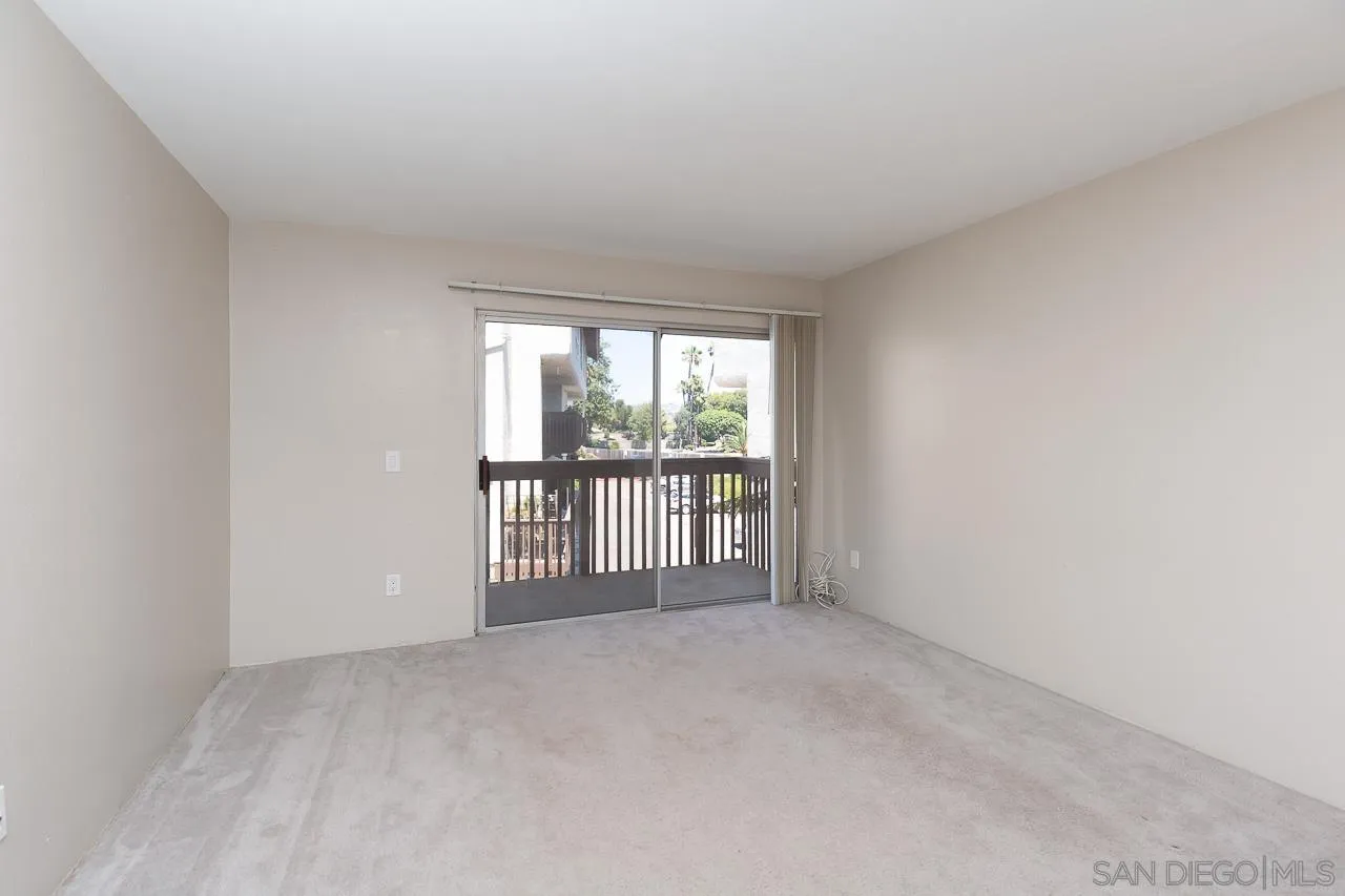 6171 Rancho Mission Road, Unit 208 San Diego, CA 92108 - Photo 2 of 18 a view of an empty room with a window