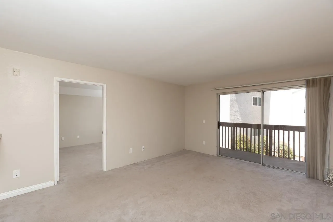 6171 Rancho Mission Road, Unit 208 San Diego, CA 92108 - Photo 3 of 18 an empty room with windows