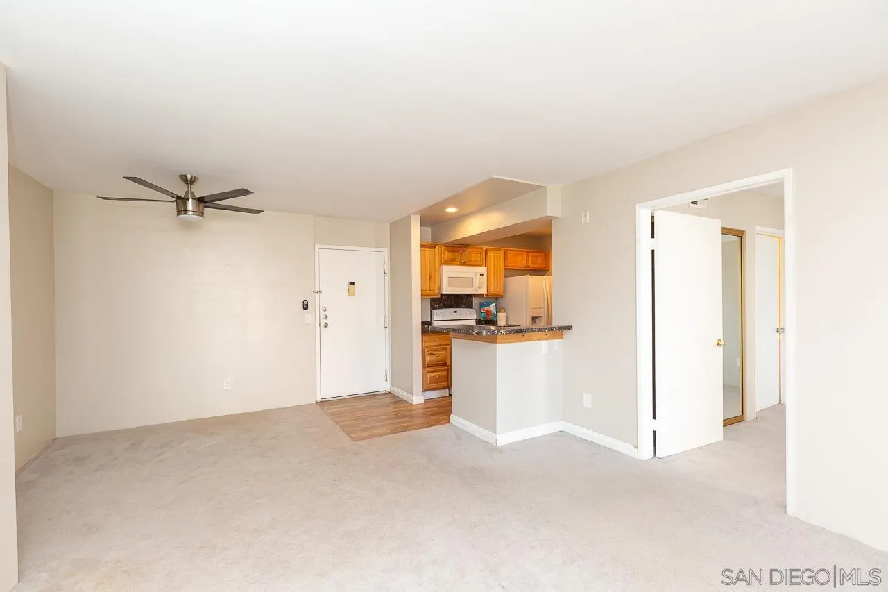 6171 Rancho Mission Road, Unit 208 San Diego, CA 92108 - Photo 4 of 18 a view of a kitchen with a sink and a window