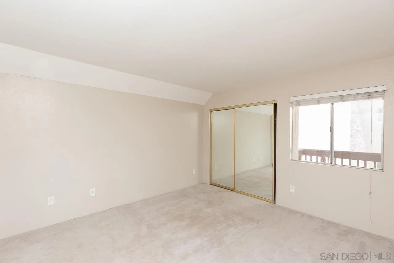 6171 Rancho Mission Road, Unit 208 San Diego, CA 92108 - Photo 7 of 18 an empty room with a empty space and windows