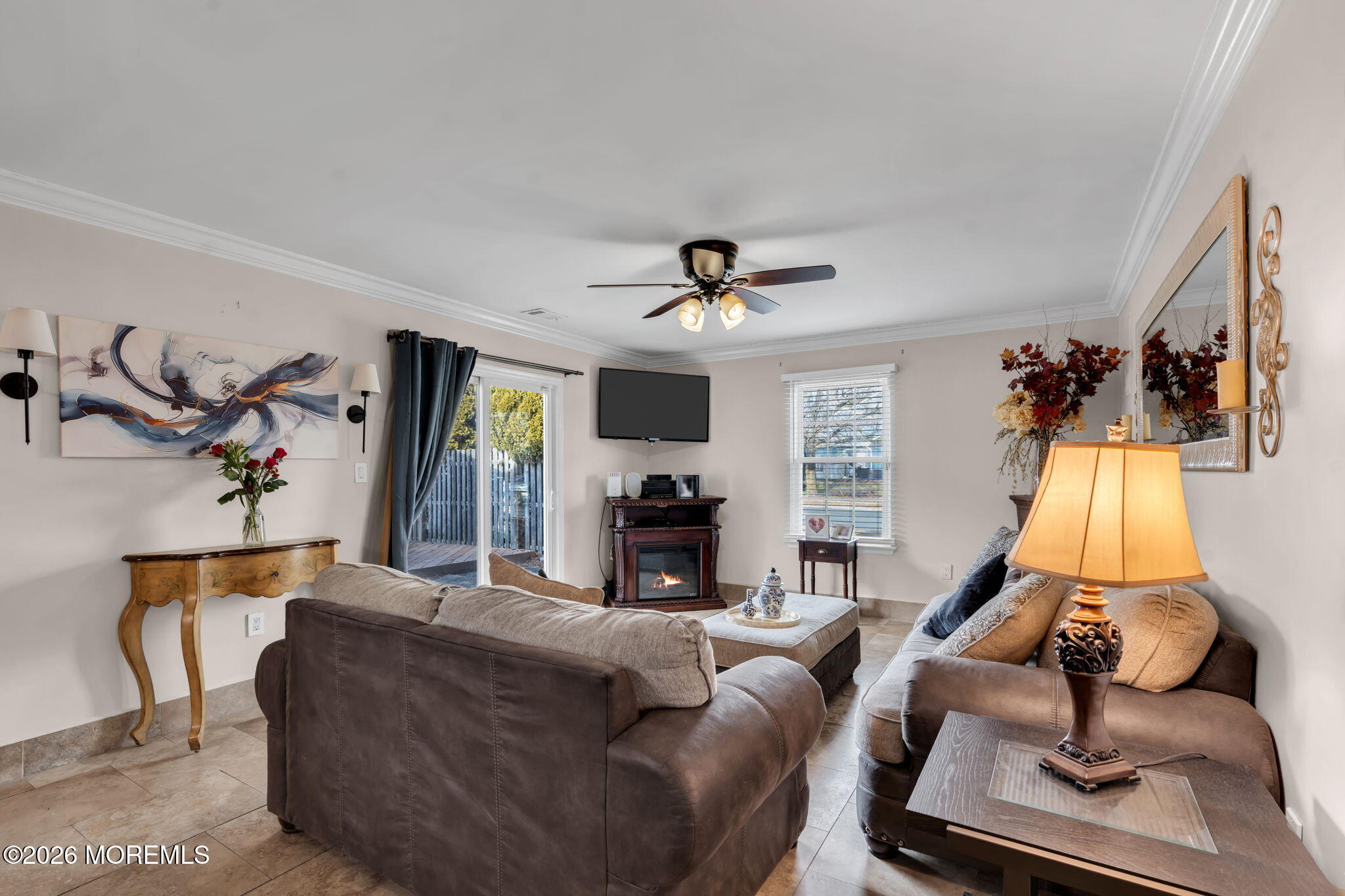 1 Breakwater Square Freehold, NJ 07728 - Photo 11 of 33 a living room with furniture gym equipment and a fireplace
