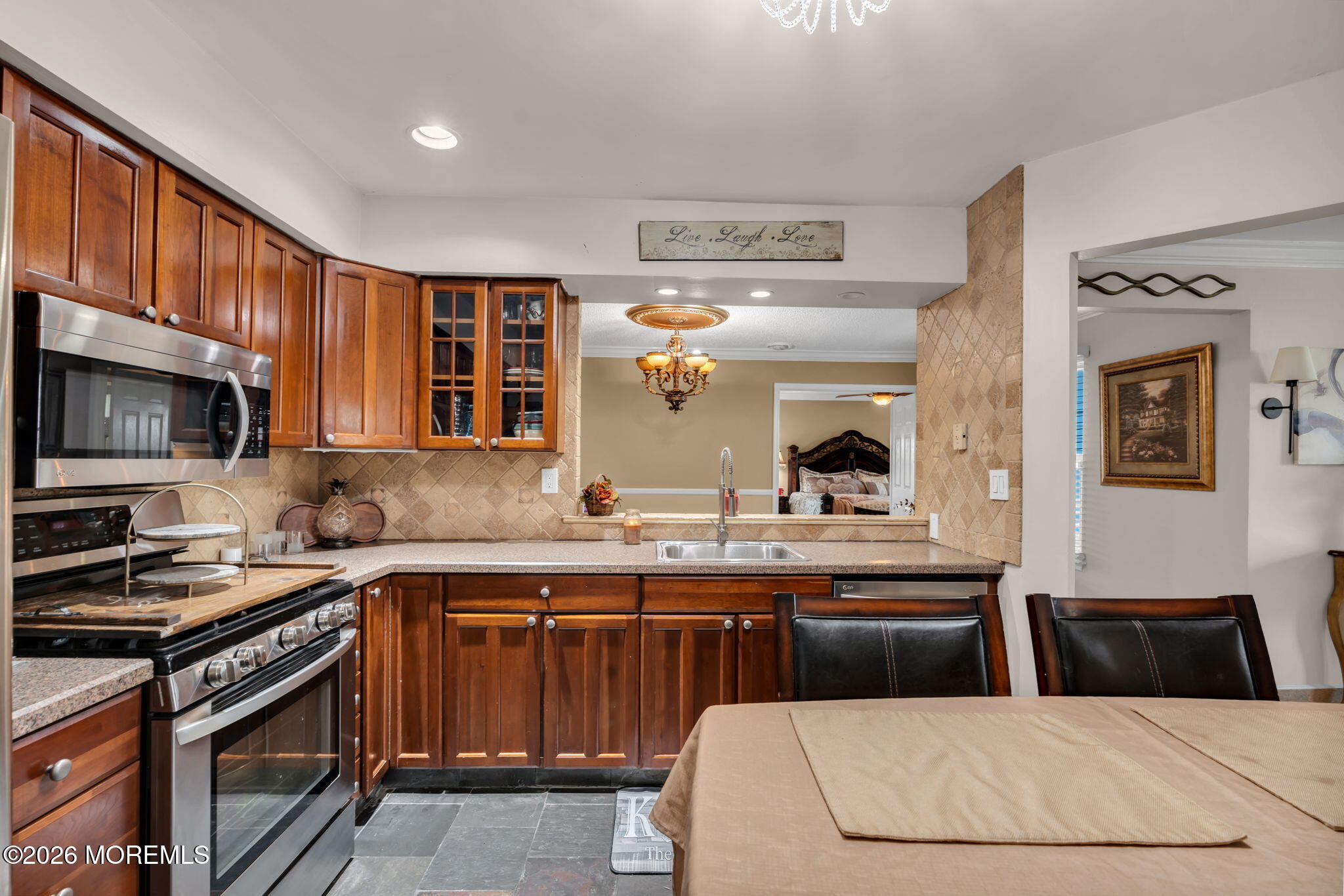 1 Breakwater Square Freehold, NJ 07728 - Photo 19 of 33 a kitchen with a sink a stove and cabinets