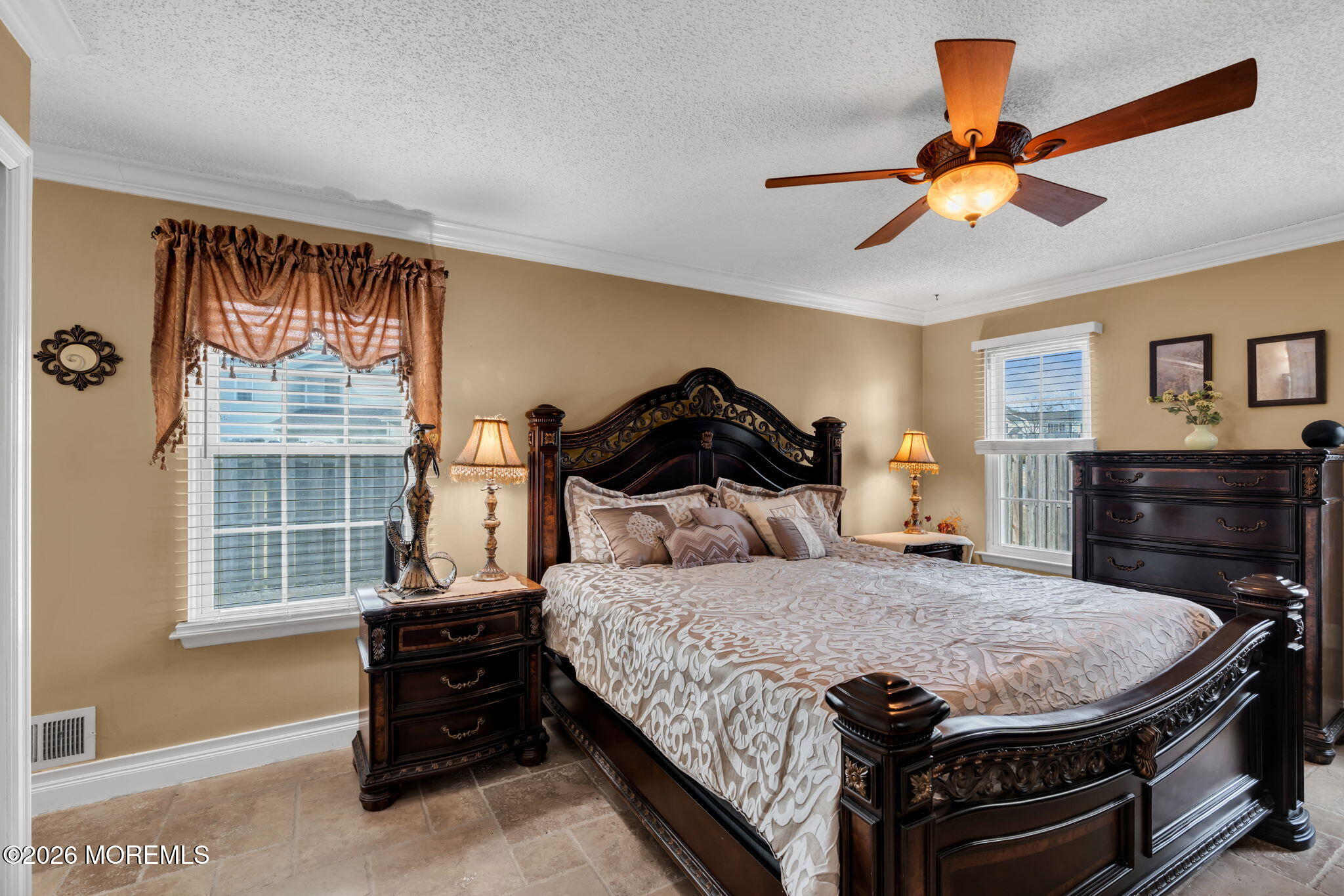 1 Breakwater Square Freehold, NJ 07728 - Photo 21 of 33 a bedroom with a bed and a chandelier