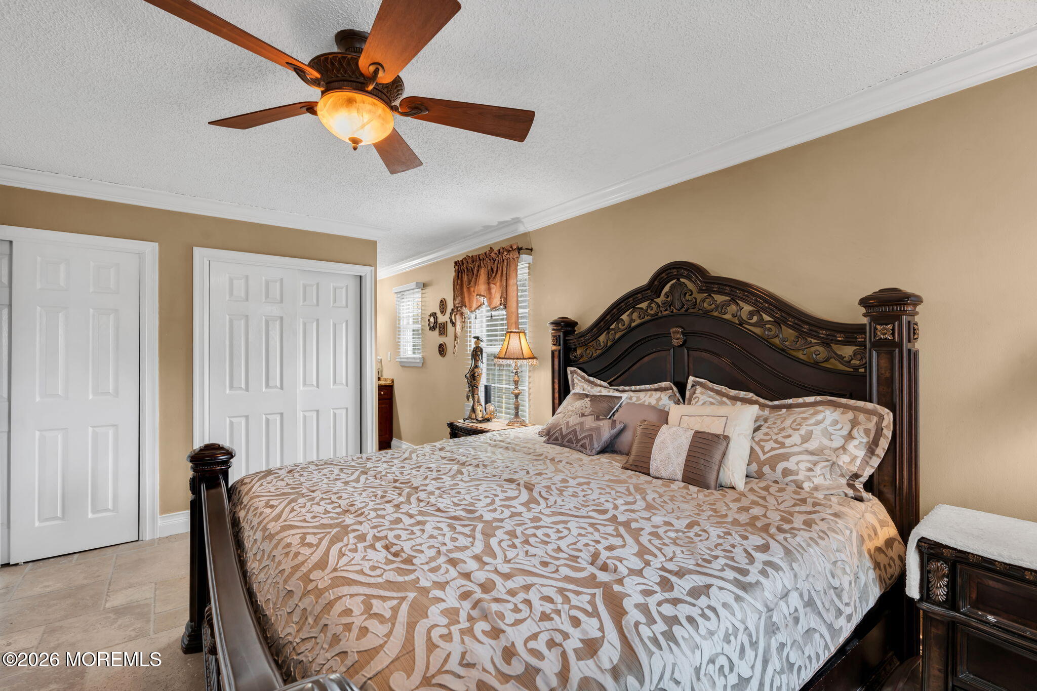 1 Breakwater Square Freehold, NJ 07728 - Photo 22 of 33 a bedroom with a bed and a ceiling fan