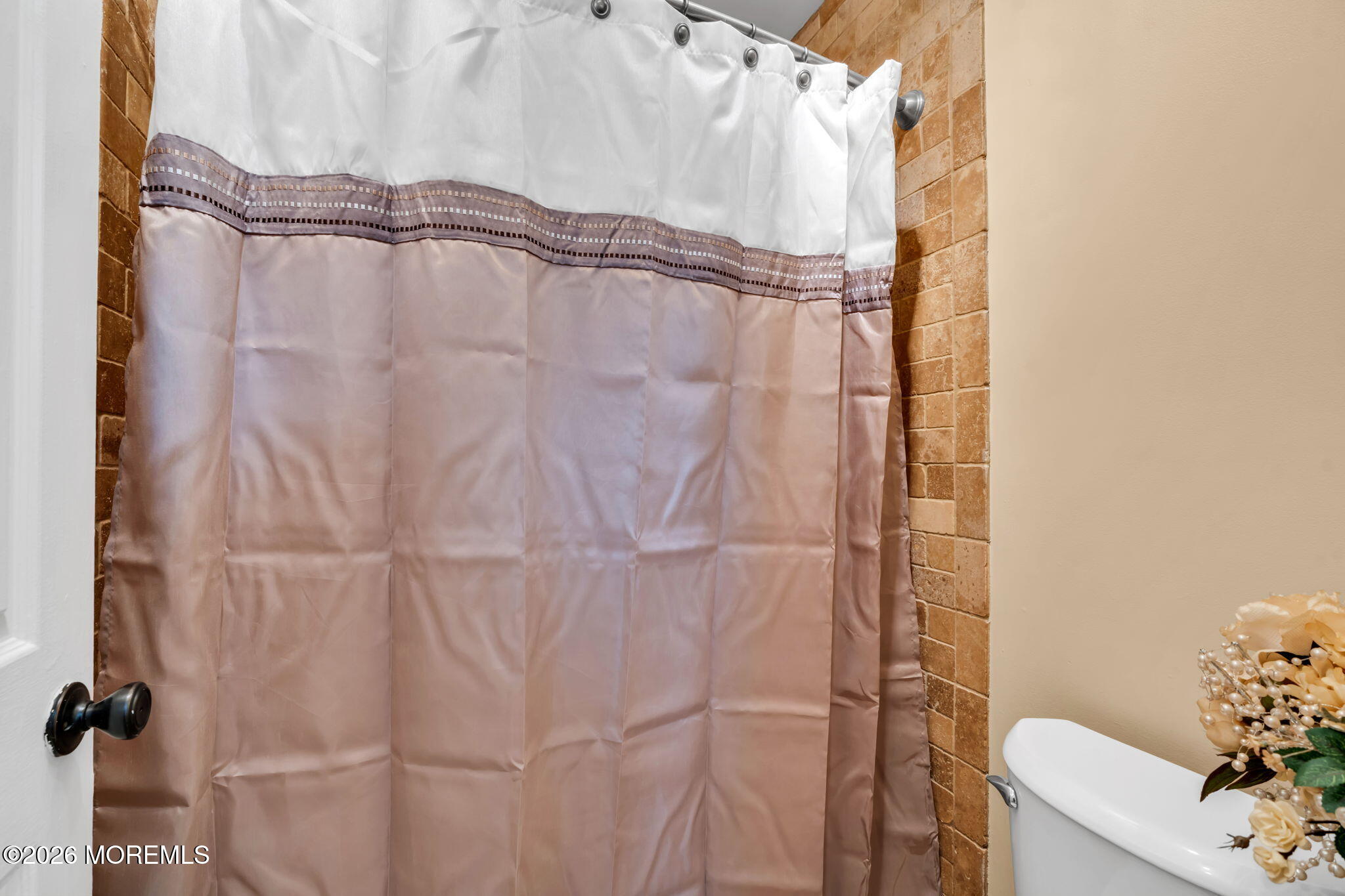 1 Breakwater Square Freehold, NJ 07728 - Photo 25 of 33 a bathroom with a shower curtain and a window