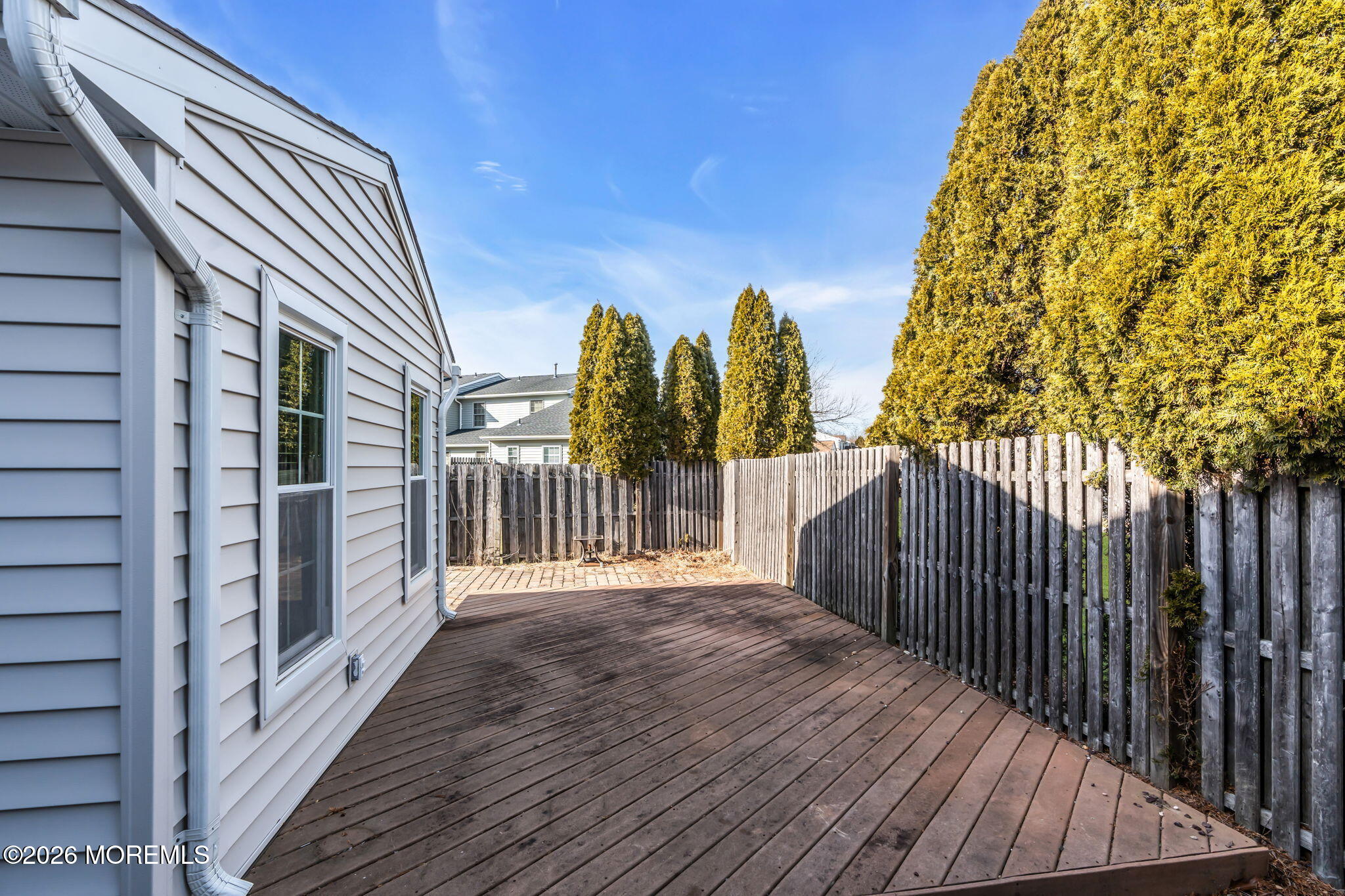 1 Breakwater Square Freehold, NJ 07728 - Photo 28 of 33 a view of a balcony with wooden floor and fence