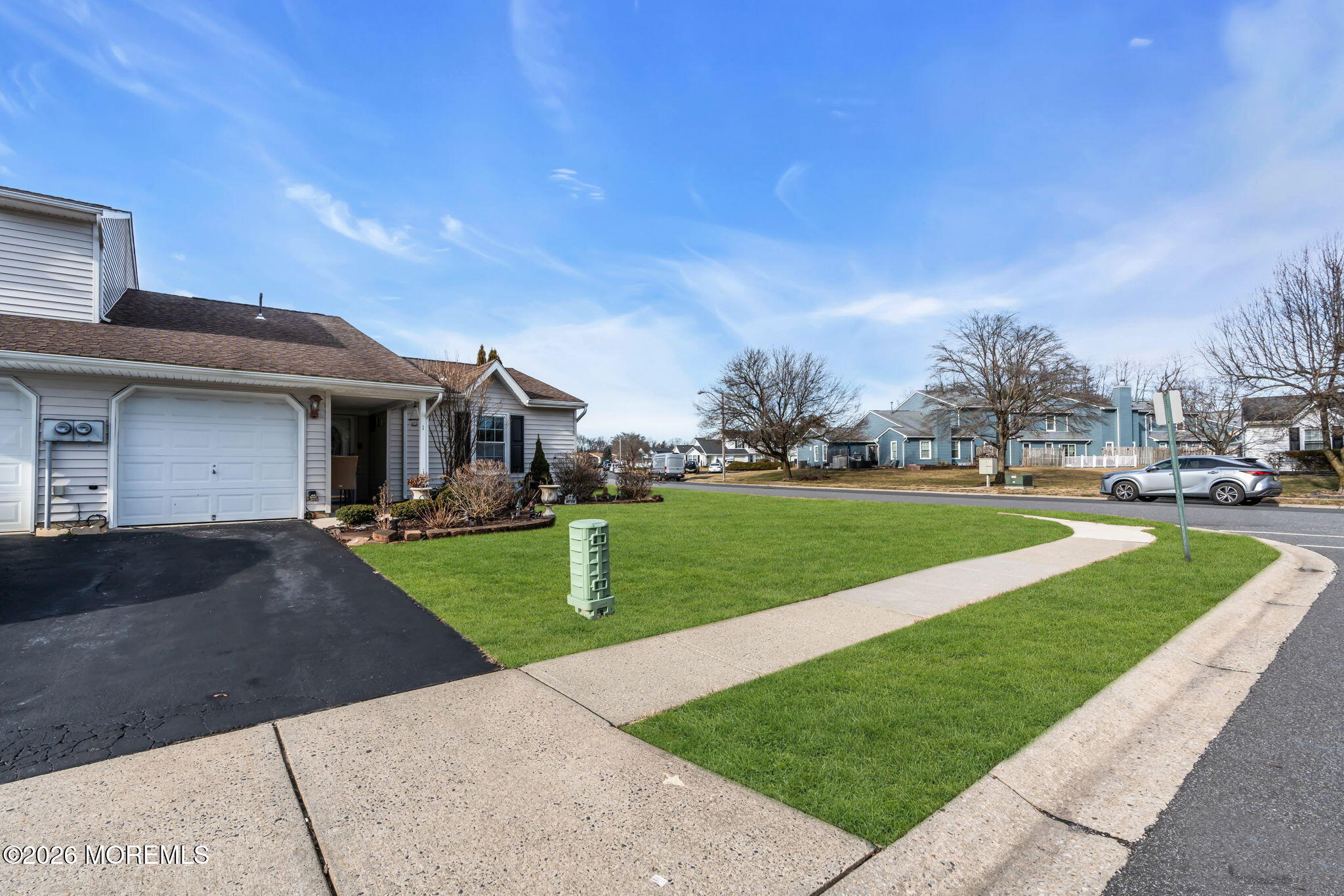 1 Breakwater Square Freehold, NJ 07728 - Photo 3 of 33 a front view of house with yard and green space
