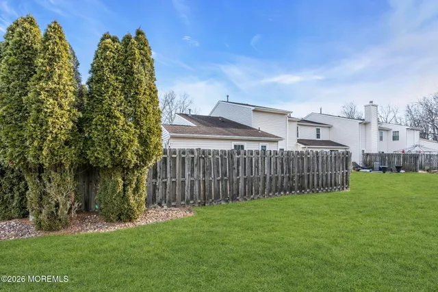 a view of a backyard with green space