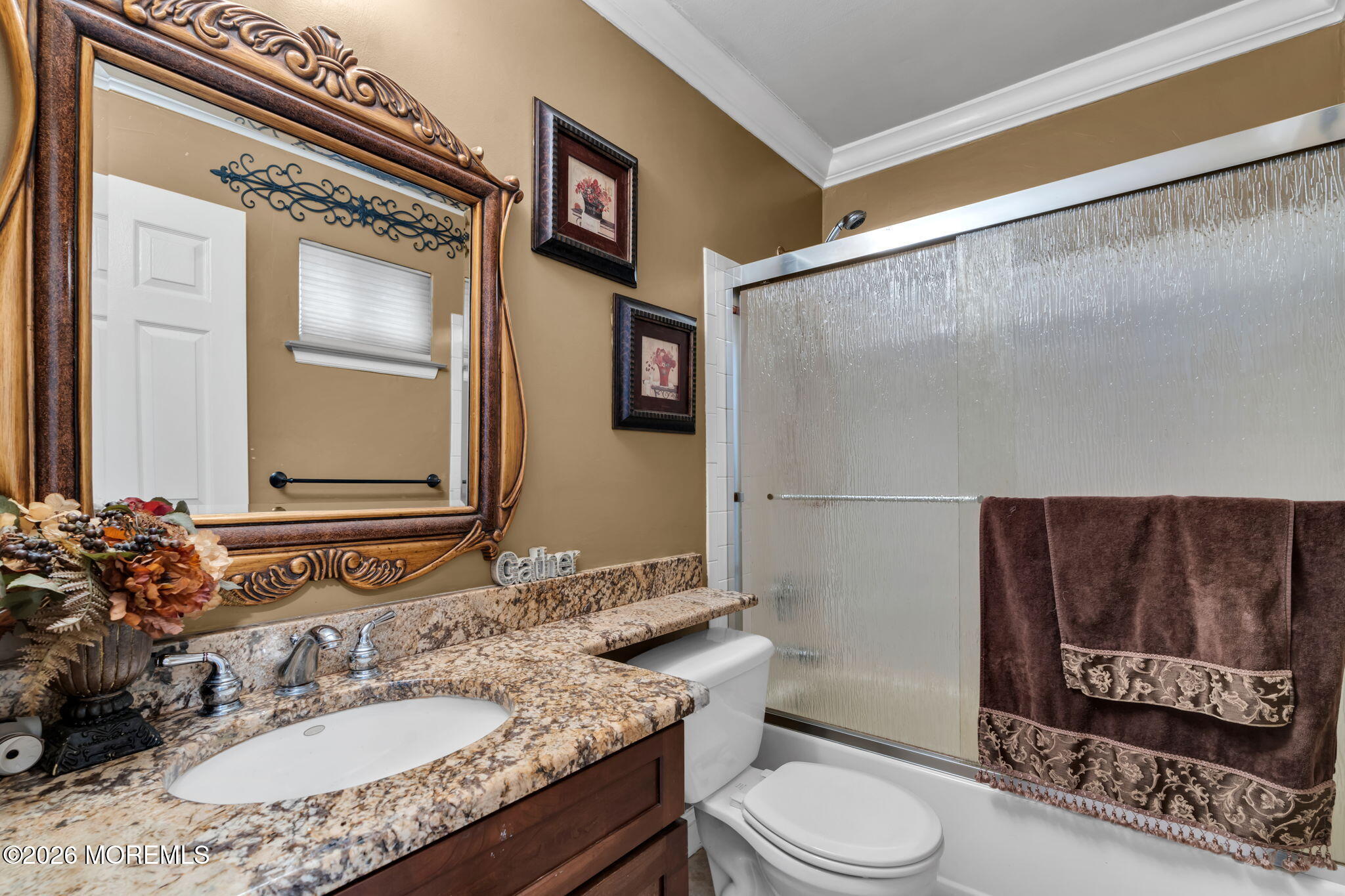 1 Breakwater Square Freehold, NJ 07728 - Photo 10 of 33 a bathroom with a granite countertop sink toilet a mirror and shower