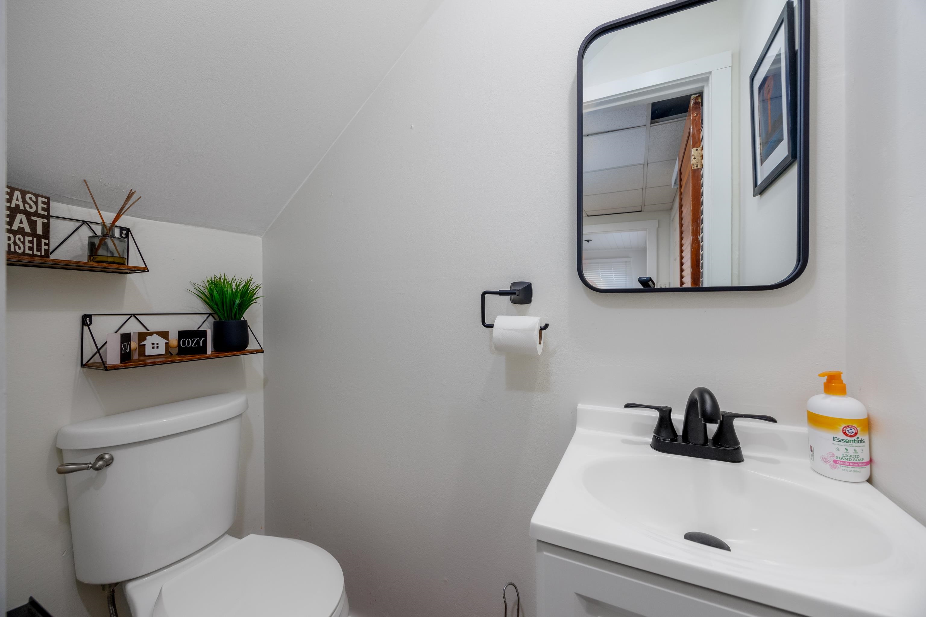 103 Bate Avenue Rio Grande, NJ 08242 - Photo 16 of 50 a bathroom with a sink a toilet and mirror