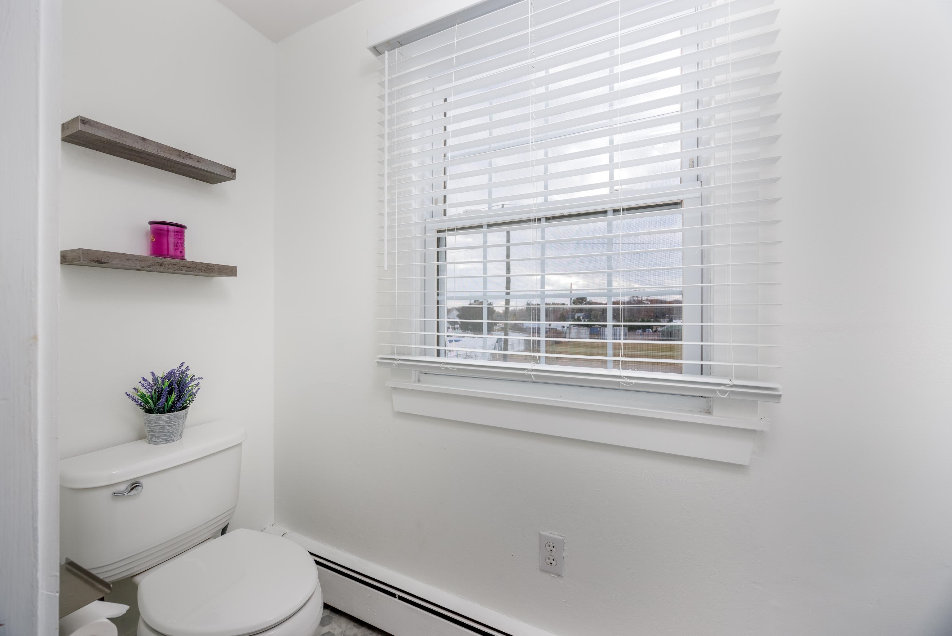 103 Bate Avenue Rio Grande, NJ 08242 - Photo 28 of 50 a white toilet sitting next to a window