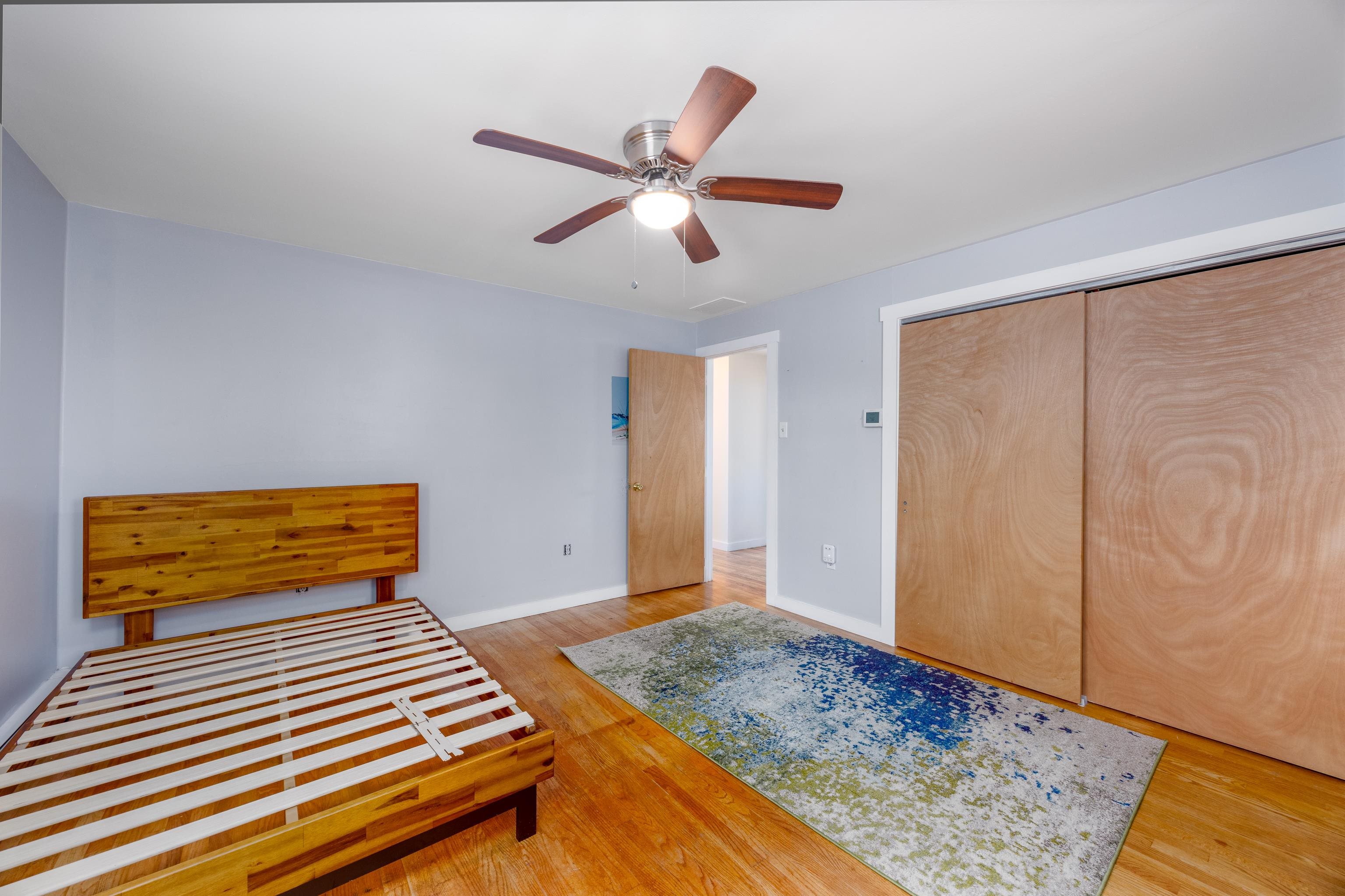 103 Bate Avenue Rio Grande, NJ 08242 - Photo 30 of 50 a bedroom with a bed and wooden floor