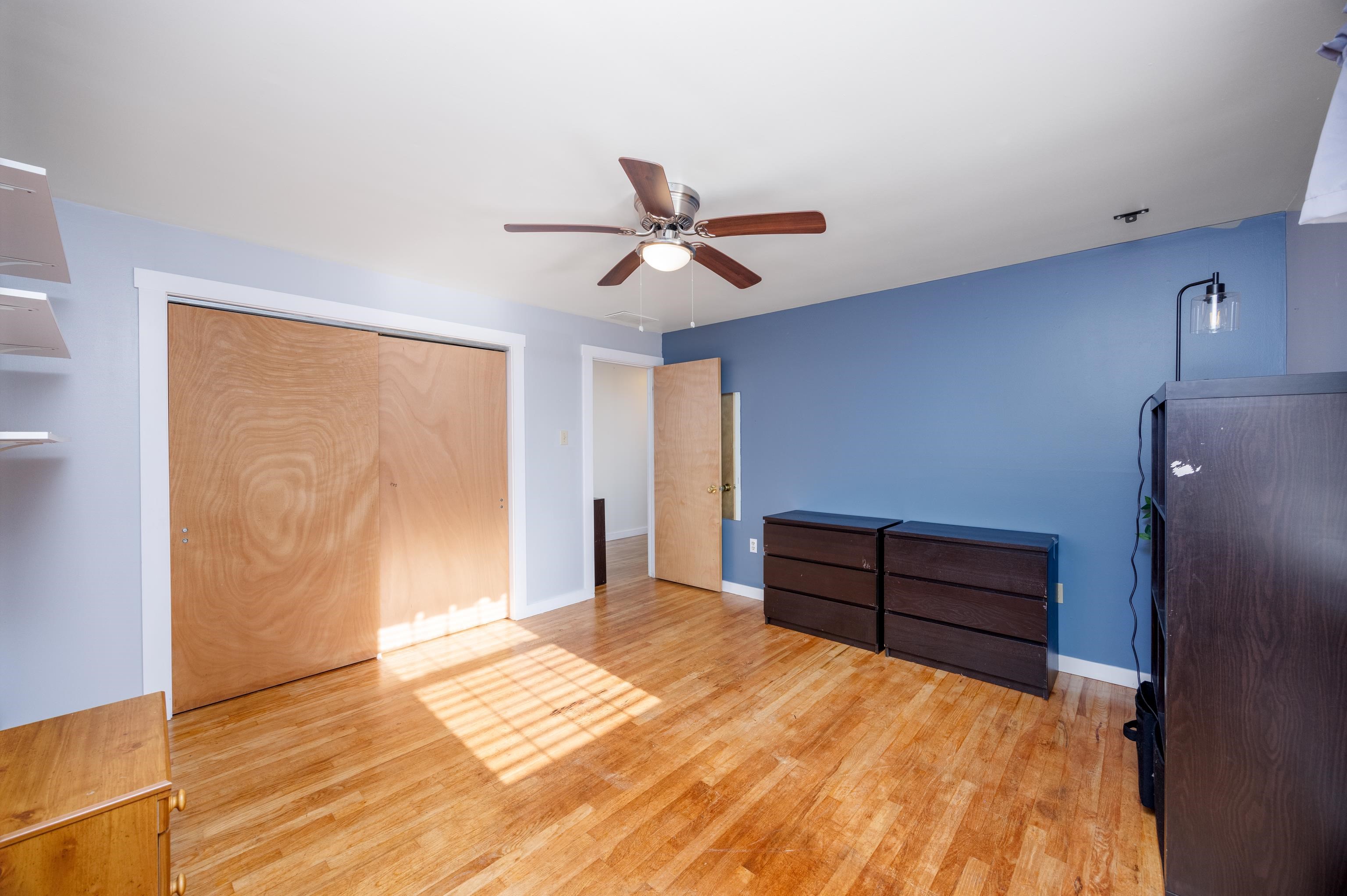 103 Bate Avenue Rio Grande, NJ 08242 - Photo 32 of 50 a bedroom with a bed and a chandelier