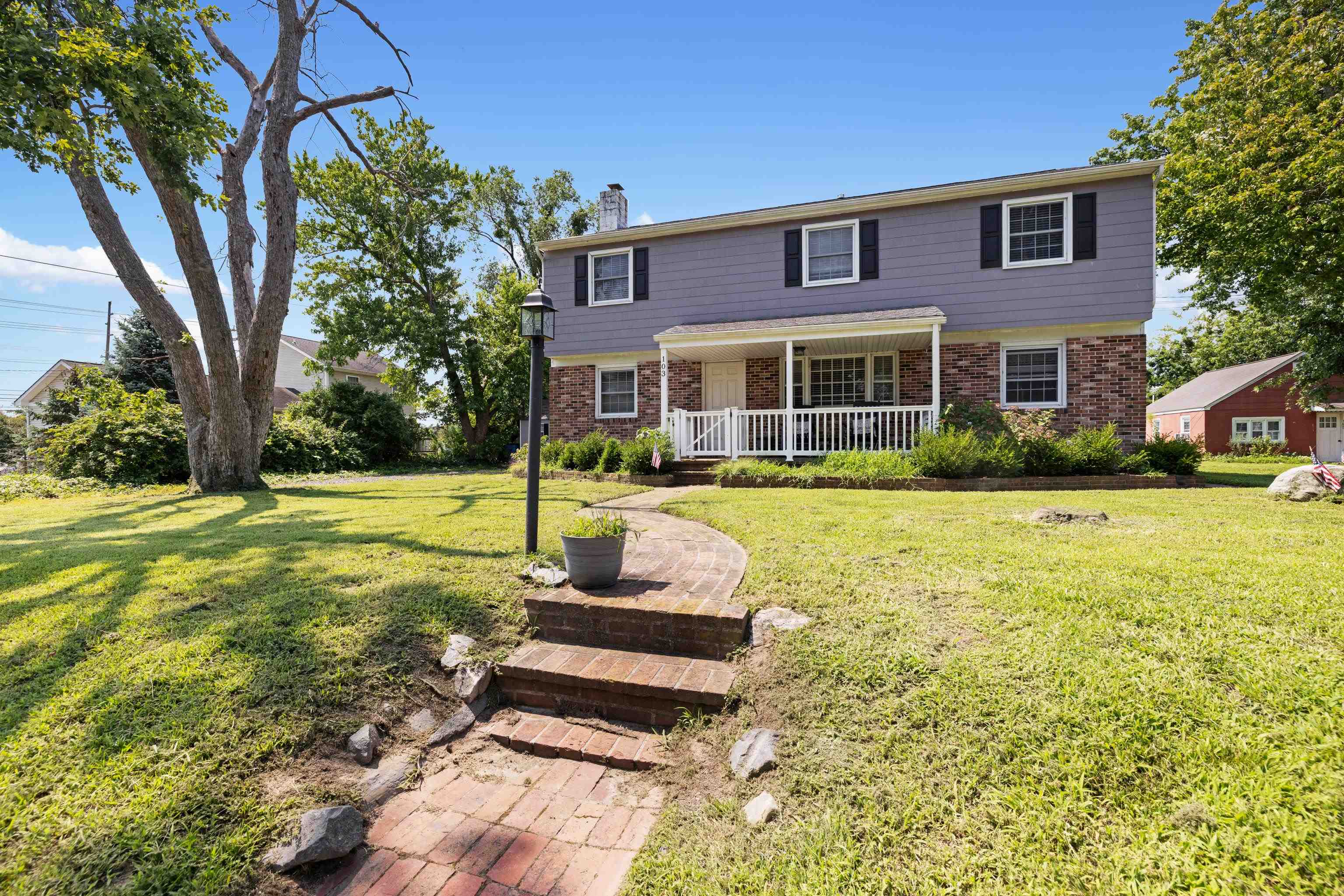 103 Bate Avenue Rio Grande, NJ 08242 - Photo 36 of 50 a front view of a house with garden and trees