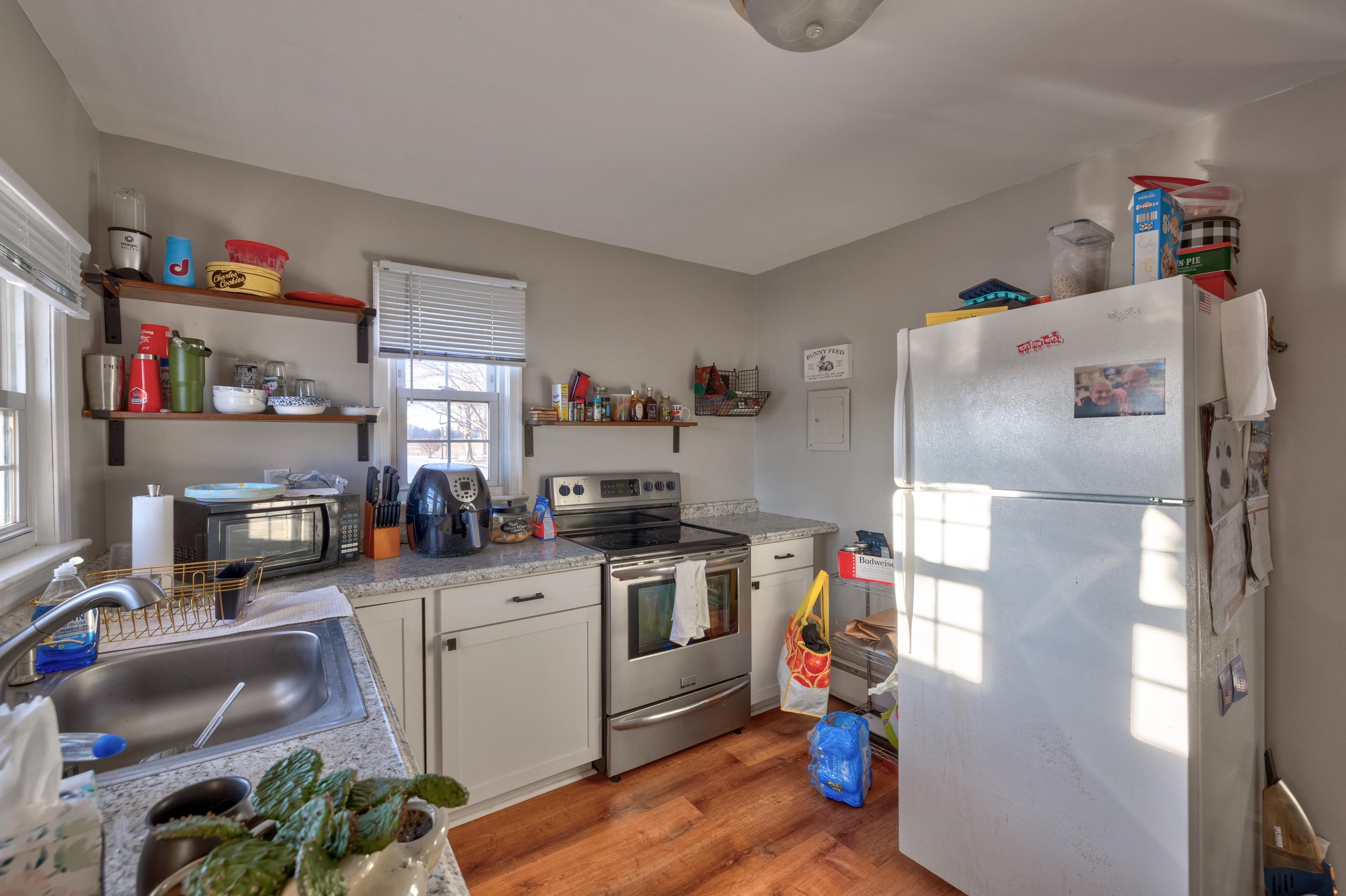 103 Bate Avenue Rio Grande, NJ 08242 - Photo 48 of 50 a kitchen with stainless steel appliances a stove a refrigerator and a refrigerator