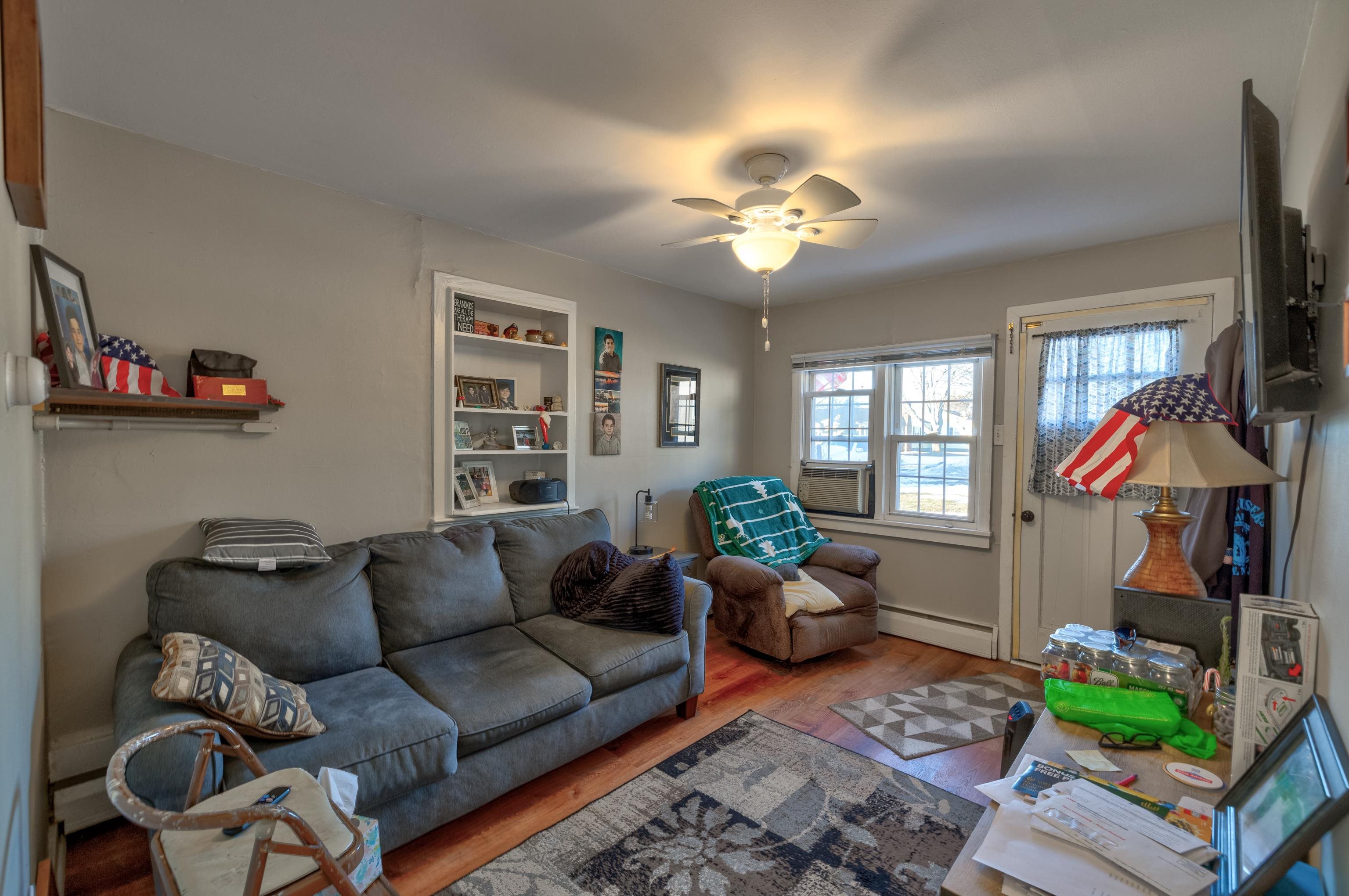 103 Bate Avenue Rio Grande, NJ 08242 - Photo 49 of 50 a living room with furniture a chandelier and a window