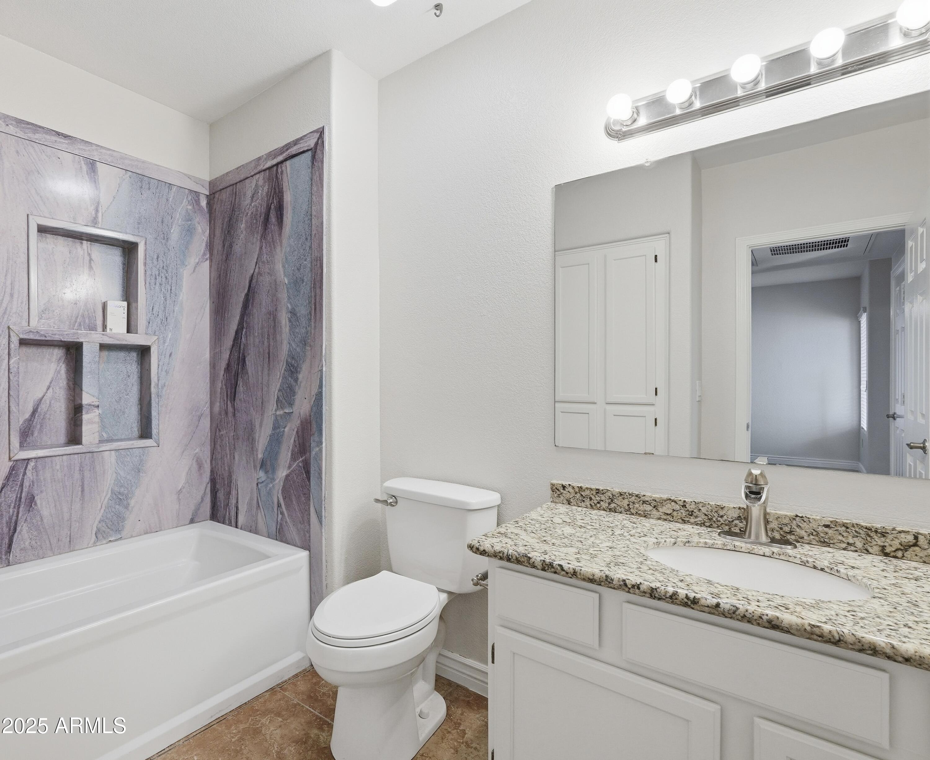 1825 West Ray Road, Unit 2145 Chandler, AZ 85224 - Photo 15 of 25 a bathroom with a granite countertop sink toilet and shower