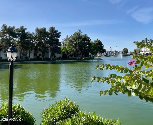 a view of a lake with a house in the background